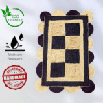 Close-up of eco-friendly jute rug’s scalloped border and rustic weave, styled with linen cushions and rattan furniture