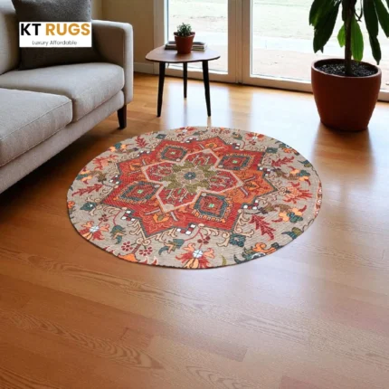 KT RUGS printed round area rug featuring a vintage boho medallion pattern in rust orange and beige, placed on a wooden floor in a living room setting.